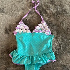 Purple and green mermaid swimsuit with floral top and skirt
